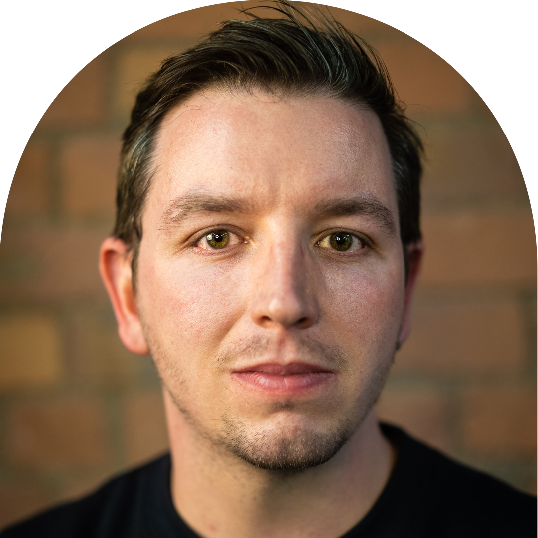 Man facing camera, looking serious. Portrait.