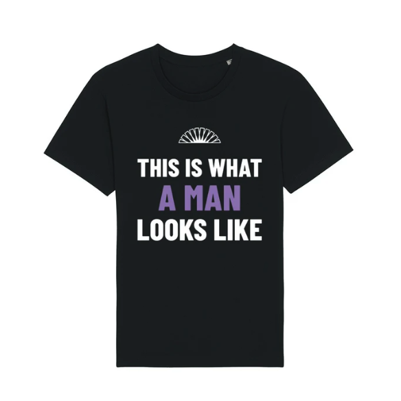 A black t-shirt on a white background with the slogan "This is What a Man Looks Like" and the LGBT Foundation logo.