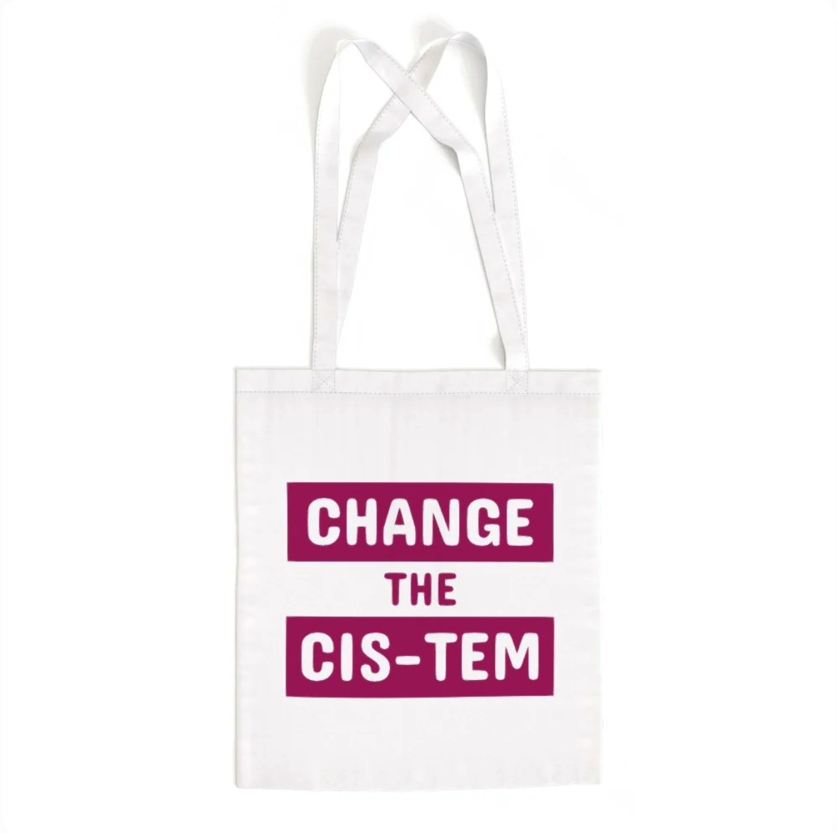 A white LGBT Foundation tote bag with the words "Change the Cis-Tem" in block capitals. The words "Change" and "Cis-Tem" are white caps on a deep pink/purple rectangle.